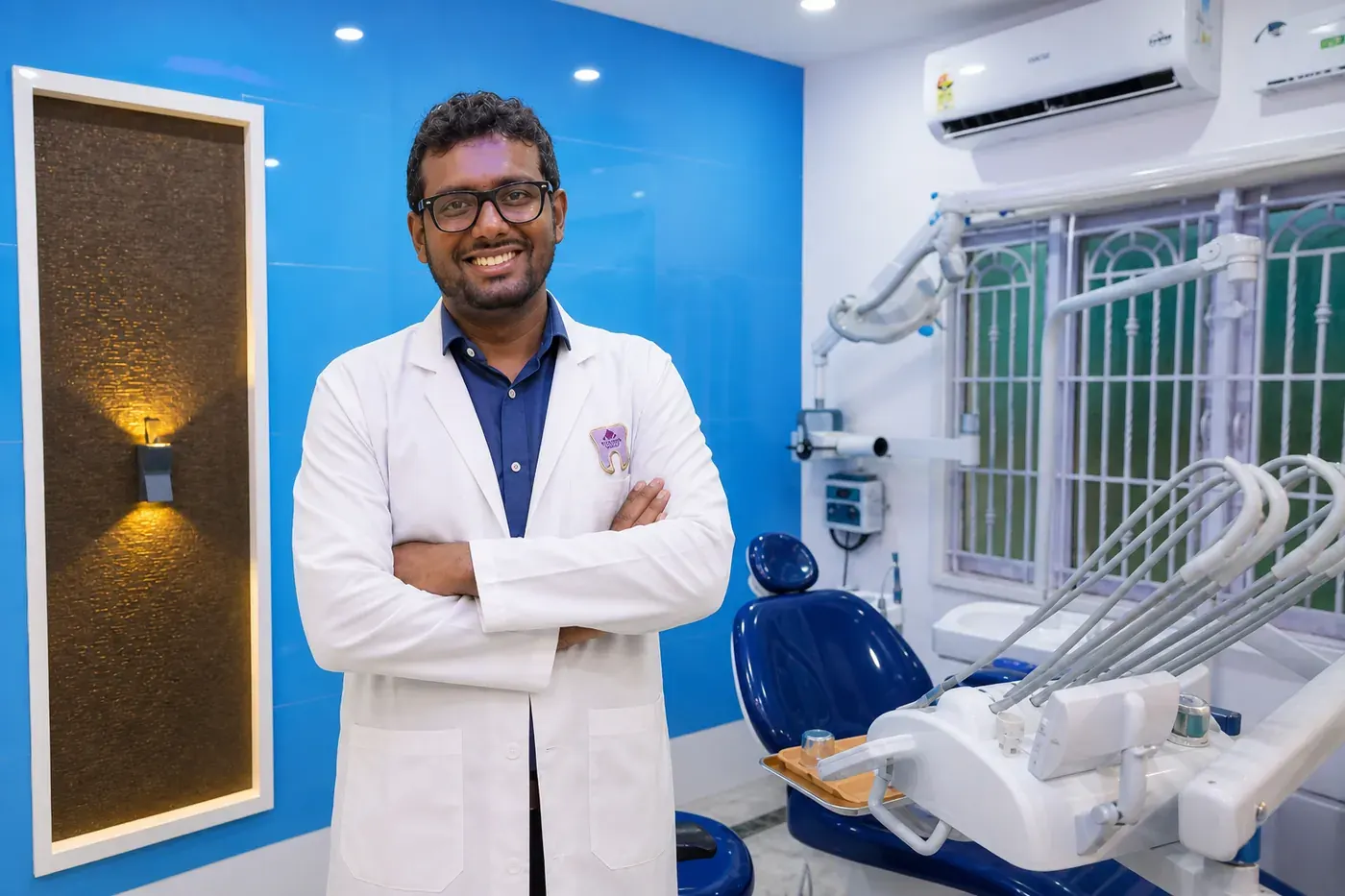 Doctor performing dental treatment at JFDC